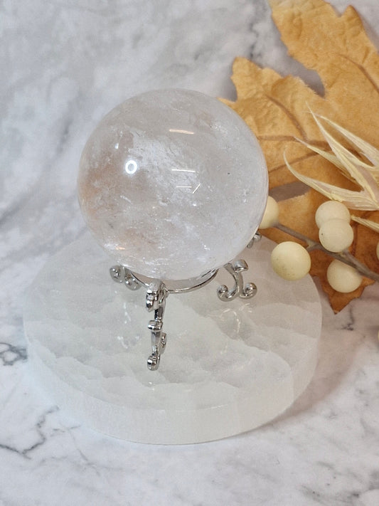 Beautiful Clear Quartz Sphere on a decorative metal stand