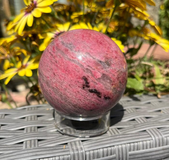 Rhodonite Sphere with Traces of Ice